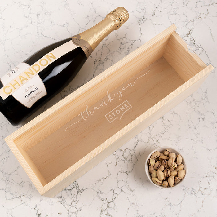Custom engraved wooden wine box with clear acrylic lid, perfect for corporate gifting.