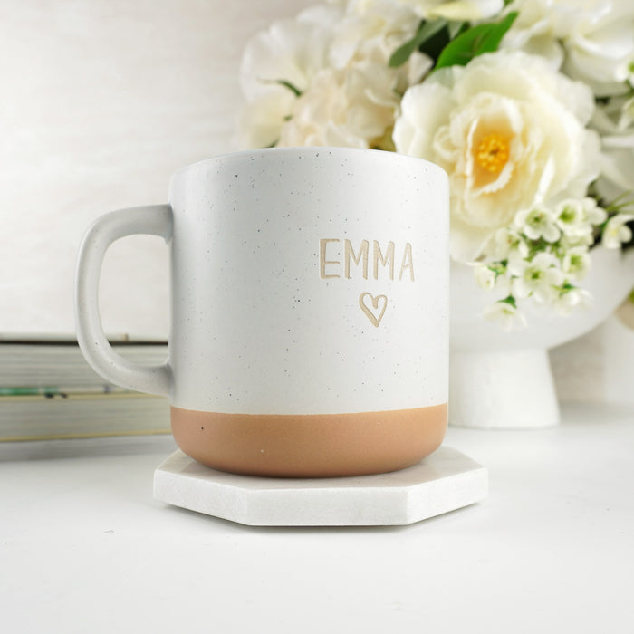 Personalised ceramic mug engraved with custom text and rustic stoneware finish