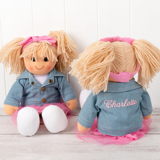 Personalised Lottie rag doll wearing pink tulle skirt and denim jacket embroidered with child’s name
