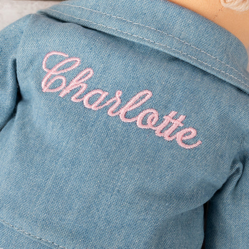 Stylish 35cm fabric doll with removable clothing, pink bow, and custom name on back of denim jacket