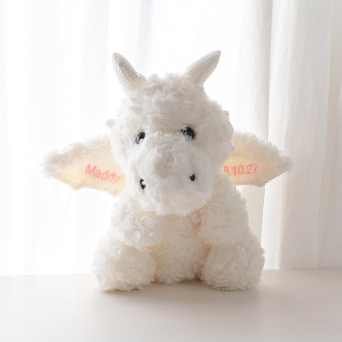 Personalised soft toy dragon named Odin with child’s name and birth date embroidered on wings, perfect newborn gift