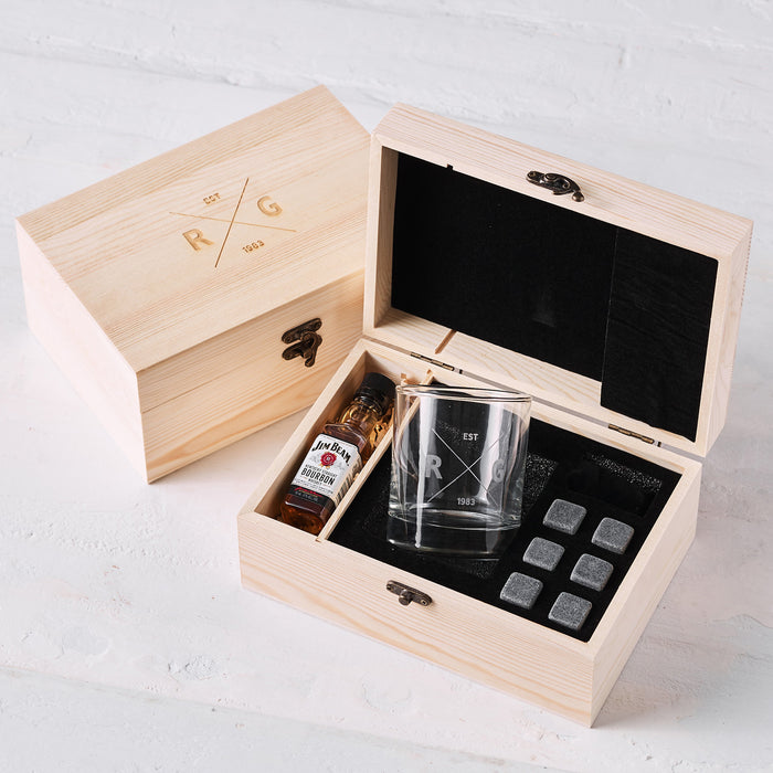 Personalised whiskey gift set in engraved wooden box with scotch glass, whiskey stones, and mini spirit bottle.