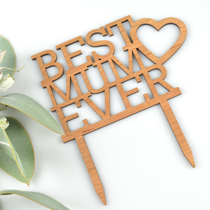 Wooden cake topper with “Best Mum Ever” design on Mother’s Day cake