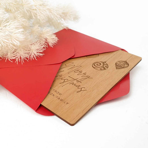 Personalised wooden Christmas card with festive engraving and envelope