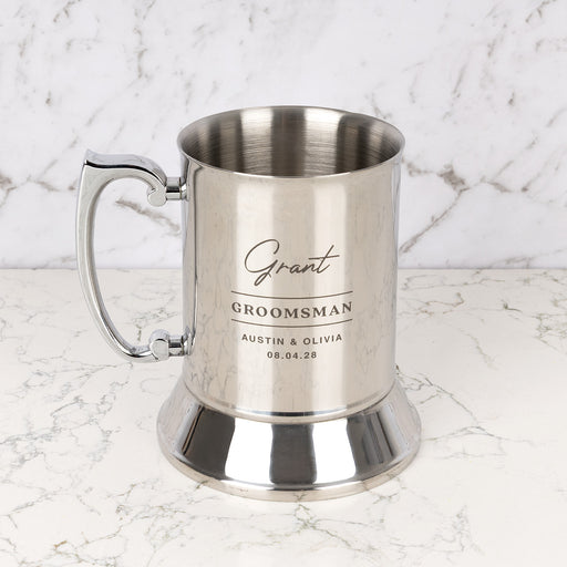 Personalised stainless steel beer mug engraved with name, wedding role and date.