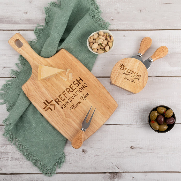 Custom logo wooden paddle board used at a corporate party with gourmet cheese presentation