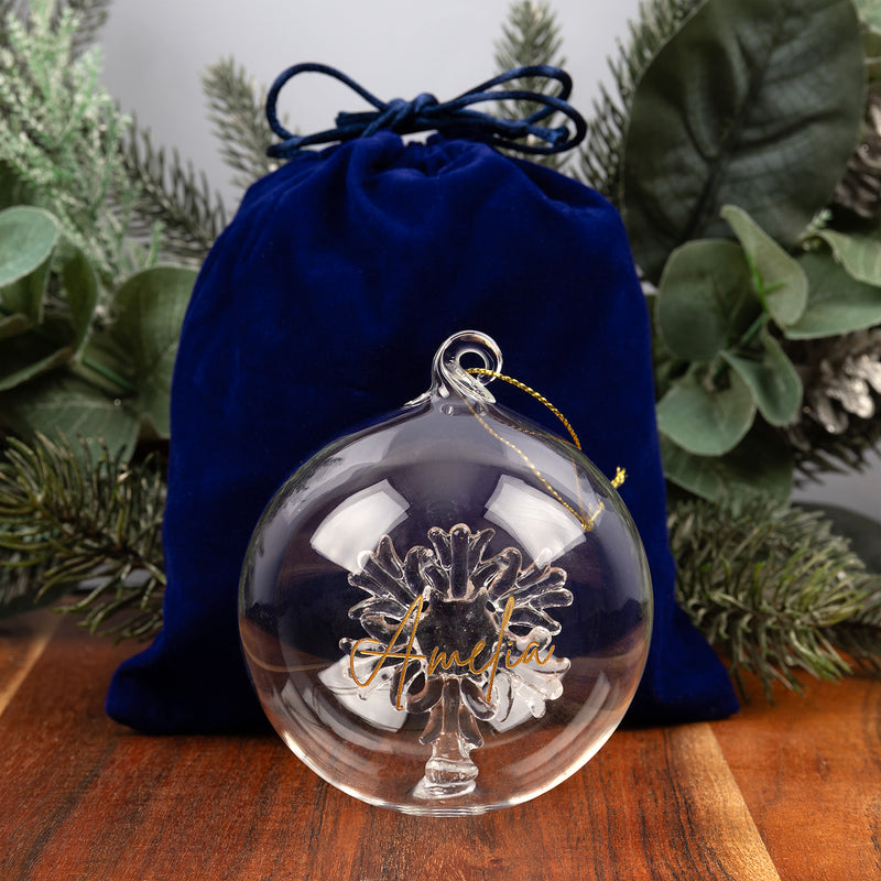 Personalised glass bauble presented in a blue velvet bag and kraft gift box