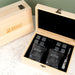 Premium corporate whiskey gift set featuring personalised glasses, whiskey stones, tongs and a velvet storage pouch presented in a wooden gift box.