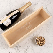 Custom engraved wooden wine box with clear acrylic lid, perfect for corporate gifting.