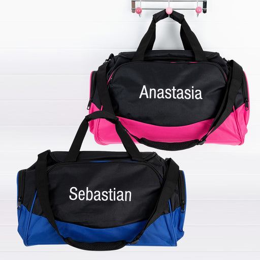 Pink and blue personalised kids’ duffle bags side by side
