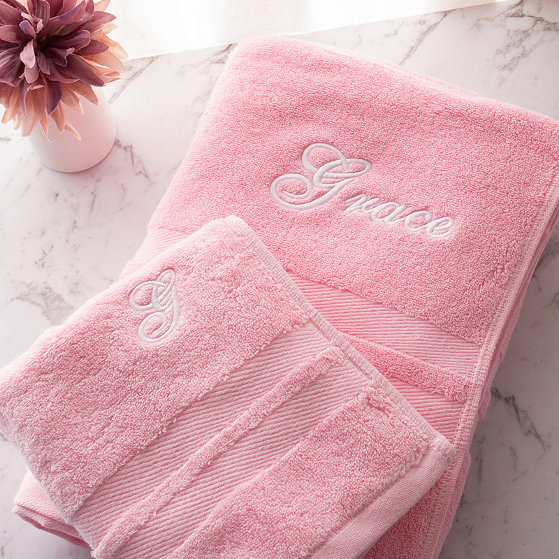 Custom pink cotton bath and hand towel set with choice of font and thread colour, ideal personalised gift for girls