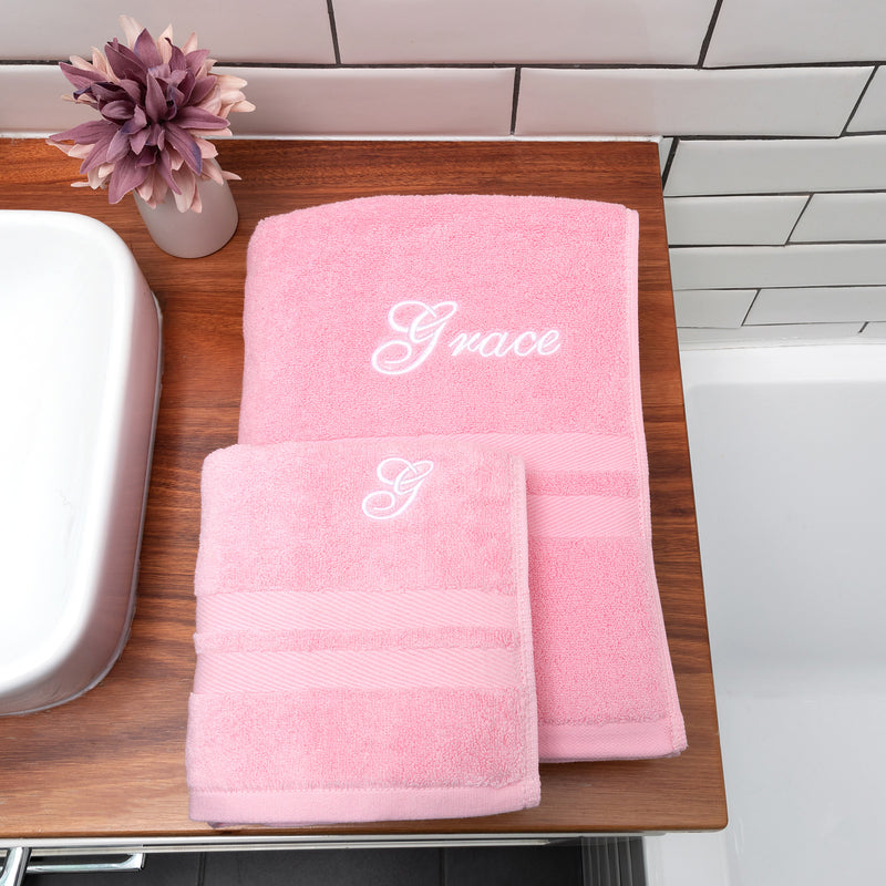 Soft and absorbent pink towel set featuring embroidered name and initial, thoughtful and practical gift for any occasion