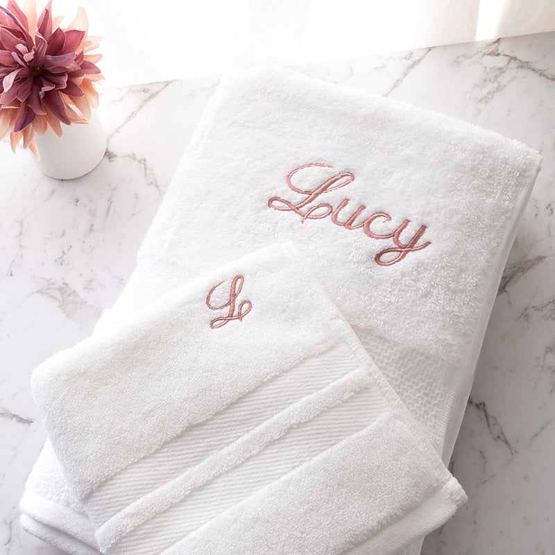 Custom white cotton bath and hand towel set with choice of thread colour and font, ideal for birthdays or newborns
