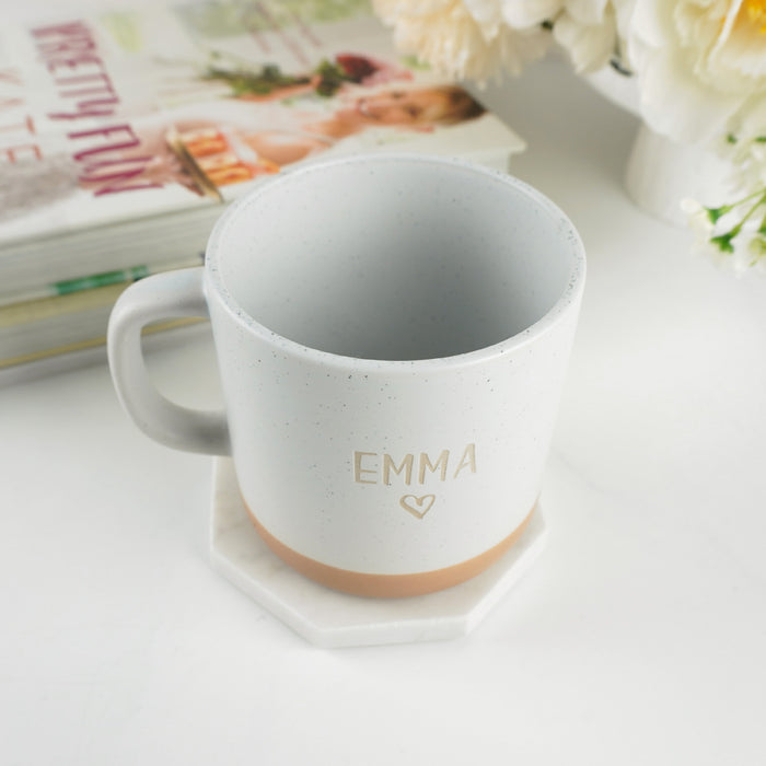 Custom coffee mug wrapped in brown kraft paper with white satin ribbon