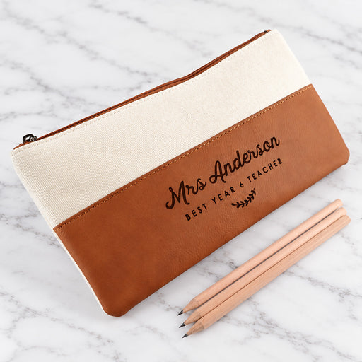 Personalised tan leatherette teacher pencil case engraved with custom name and design.