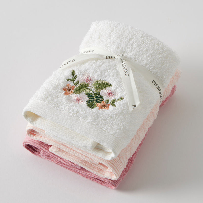 Set of 3 face washers with one embroidered floral design and two plain cotton towels in gift wrap