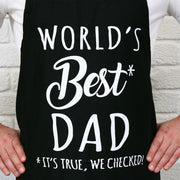 Father wearing World’s Best Dad BBQ apron while cooking at the grill