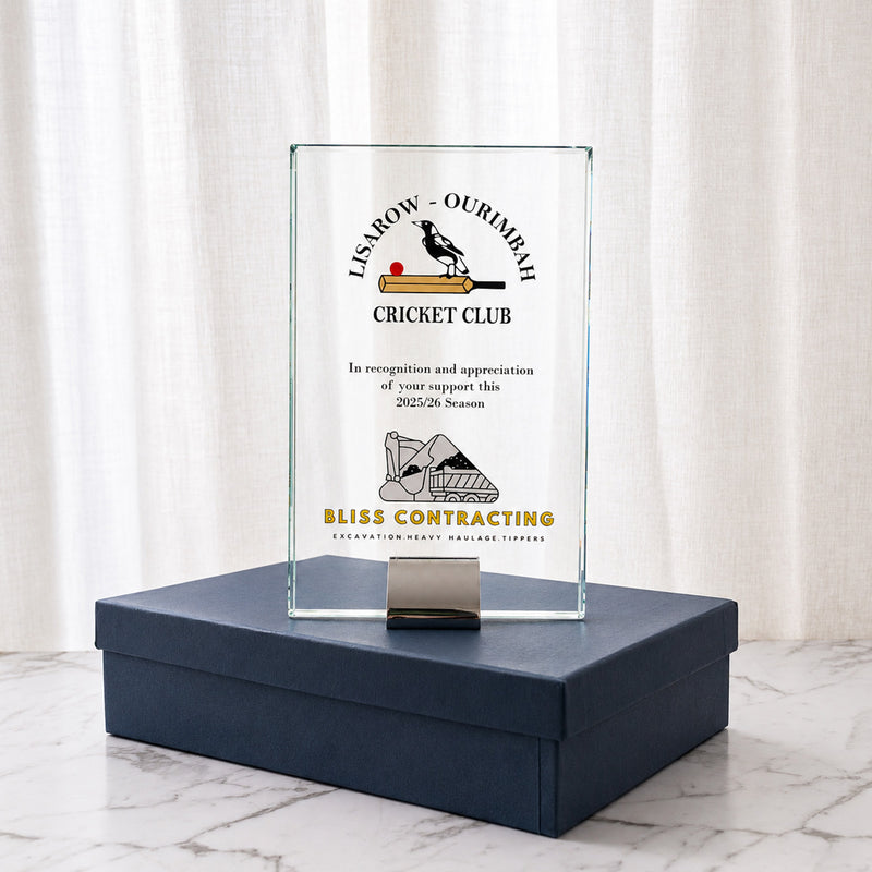 Custom printed glass achievement award presented in a navy gift box with black satin lining.