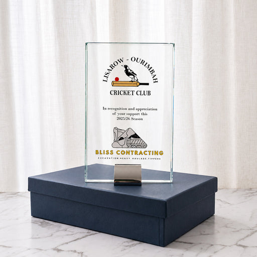 Custom printed glass achievement award presented in a navy gift box with black satin lining.