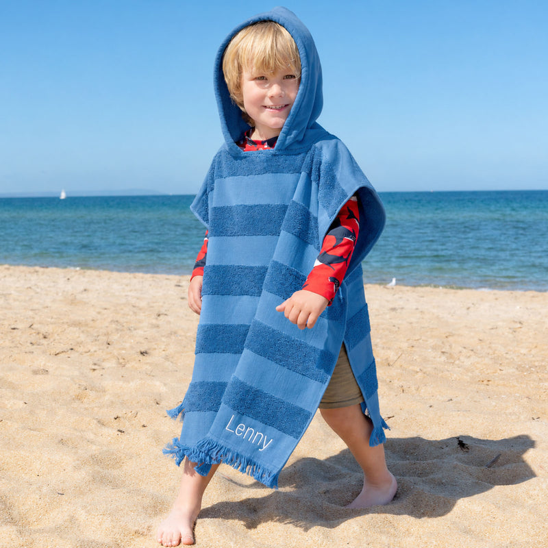 Personalised denim blue kids hooded beach towel with embroidered name and textured stripe design.