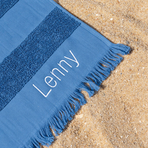 Denim blue cotton hooded beach towel for kids, personalised with their name, perfect for swimming lessons and beach days.