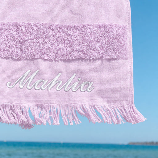 Lilac cotton hooded beach towel for kids, personalised with their name, perfect for swimming lessons, beach days and poolside fun.