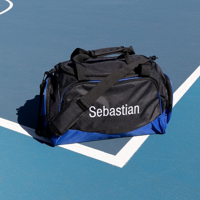Children’s blue duffle bag with custom name embroidery and spacious compartments
