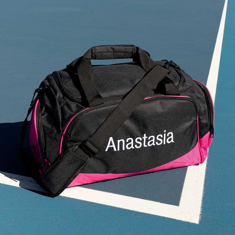 Pink kids’ sports bag with side pockets and shoe tunnel – customised for holiday gifting