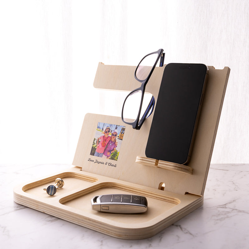 Personalised wooden accessories holder printed with a family photo, designed to organise a phone, watch, keys, wallet and glasses.