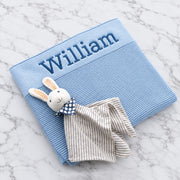 Personalised baby blue knitted blanket embroidered with name