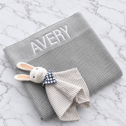 Personalised grey knitted baby blanket embroidered with name