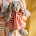 Soft and cuddly personalised bunny toy standing 40cm tall, featuring a removable pink cotton dress embroidered with a name.