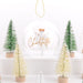 Decorative scene with Christmas trees and a snow globe featuring an angel and 'Charlotte' text.