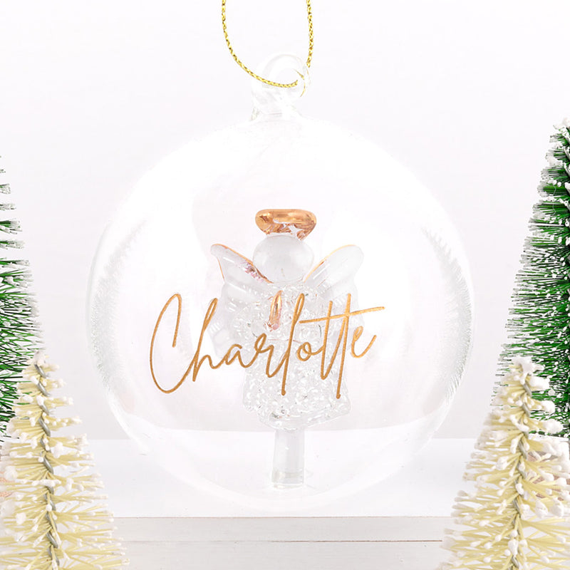 Glass ornament with delicate angel and gold hanging loop, ideal for meaningful gifting