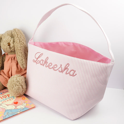 Personalised pink striped Easter basket with embroidered name and checkered interior.