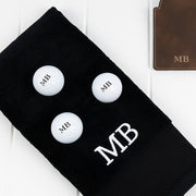 Custom golf gift hamper including engraved tee holder, scorecard holder, personalised golf balls and black golf towel for golfers.