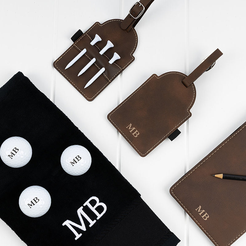 Engraved golf hamper for Dad featuring personalised golf towel, printed golf balls, tee holder and scorecard holder with initials.