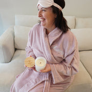 Blush pink silk eye mask with engraved lid soy candle and robe
