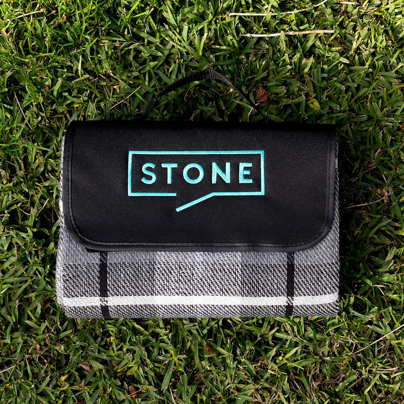 Outdoor picnic setup featuring personalised corporate picnic blanket