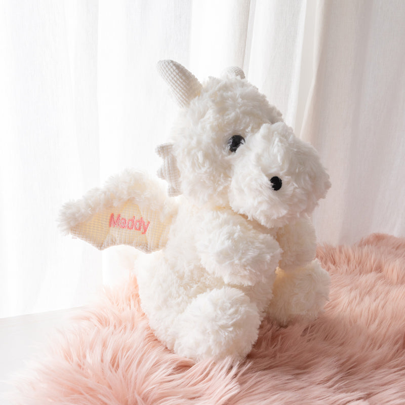 Custom newborn gift plush dragon featuring name and birth date on wings, made from ultra-soft fabric for snuggles