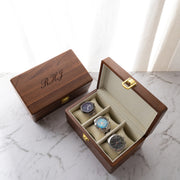 Personalised walnut wood watch box with gold latch, velvet interior, and space for three timepieces