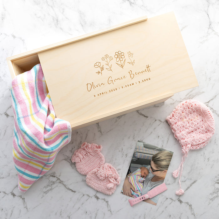 Personalised newborn keepsake box in pine wood designed to hold birth announcements and treasured first year items