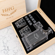 Engraved anniversary decanter set personalised with names and wedding date, complete with matching whiskey glasses and reusable chilling stones.