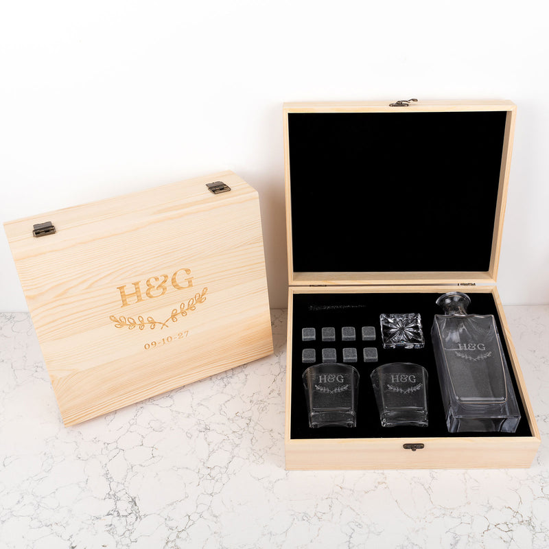 Engraved wooden box holding a custom scotch decanter and glasses, the perfect unique anniversary gift for celebrating love and memories