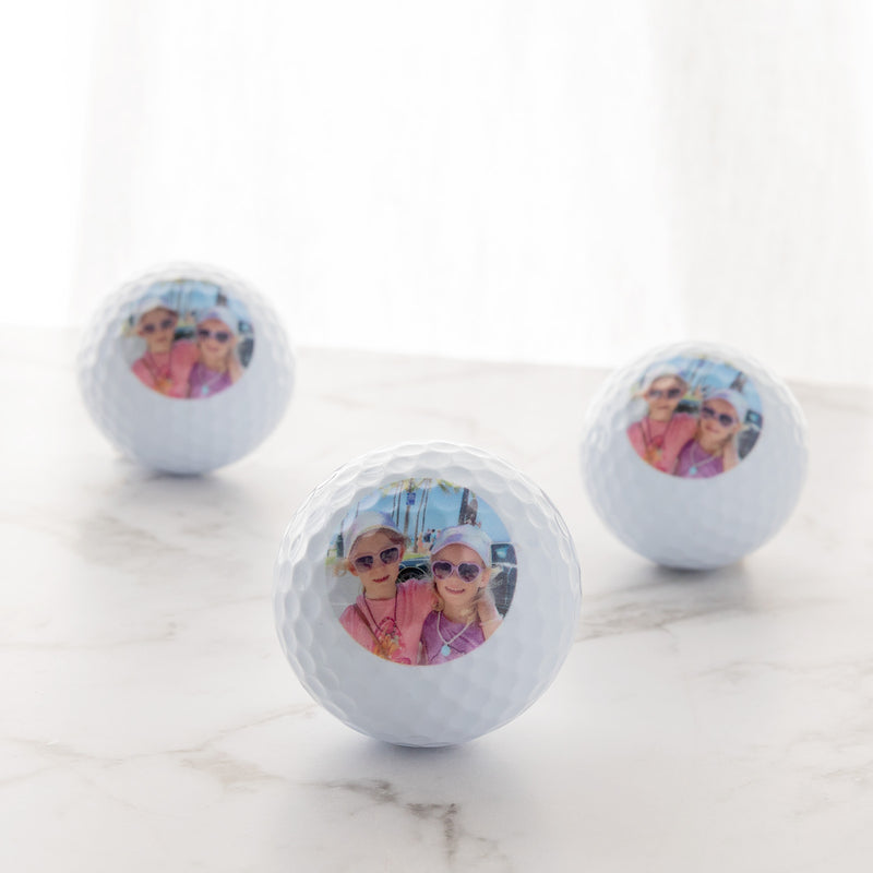 Close-up of custom golf balls printed with a photo, perfect gift for Father’s Day or birthdays.