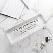 Custom acrylic desk sign available in black or white UV printed text