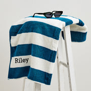 Teal striped personalised towel for kids, featuring black name stitching for easy identification