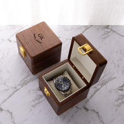 Engraved wooden watch box made from premium walnut, designed to protect and display one watch in style.