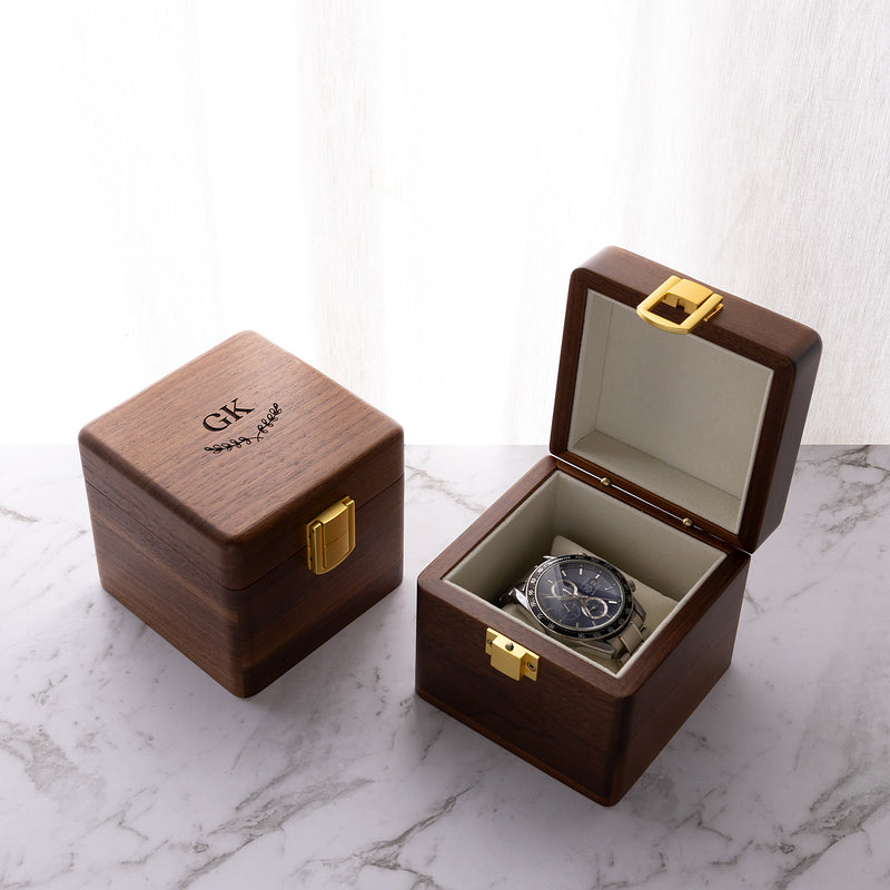 Personalised walnut single watch box with custom engraving, gold clasp and soft velvet watch cushion.