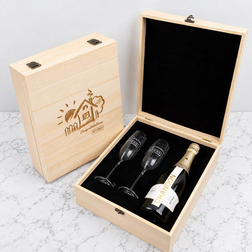 Personalised corporate Champagne gift set with two engraved flutes, bottle of bubbles and company logo on a wooden presentation box.